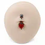 Piercing nombril tête de mort cœur